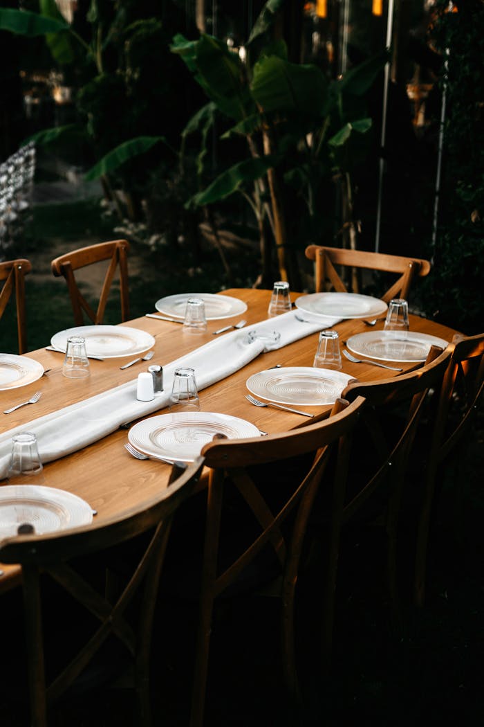 gallery-1 Beautifully arranged dining table set outdoors, perfect for elegant gatherings.