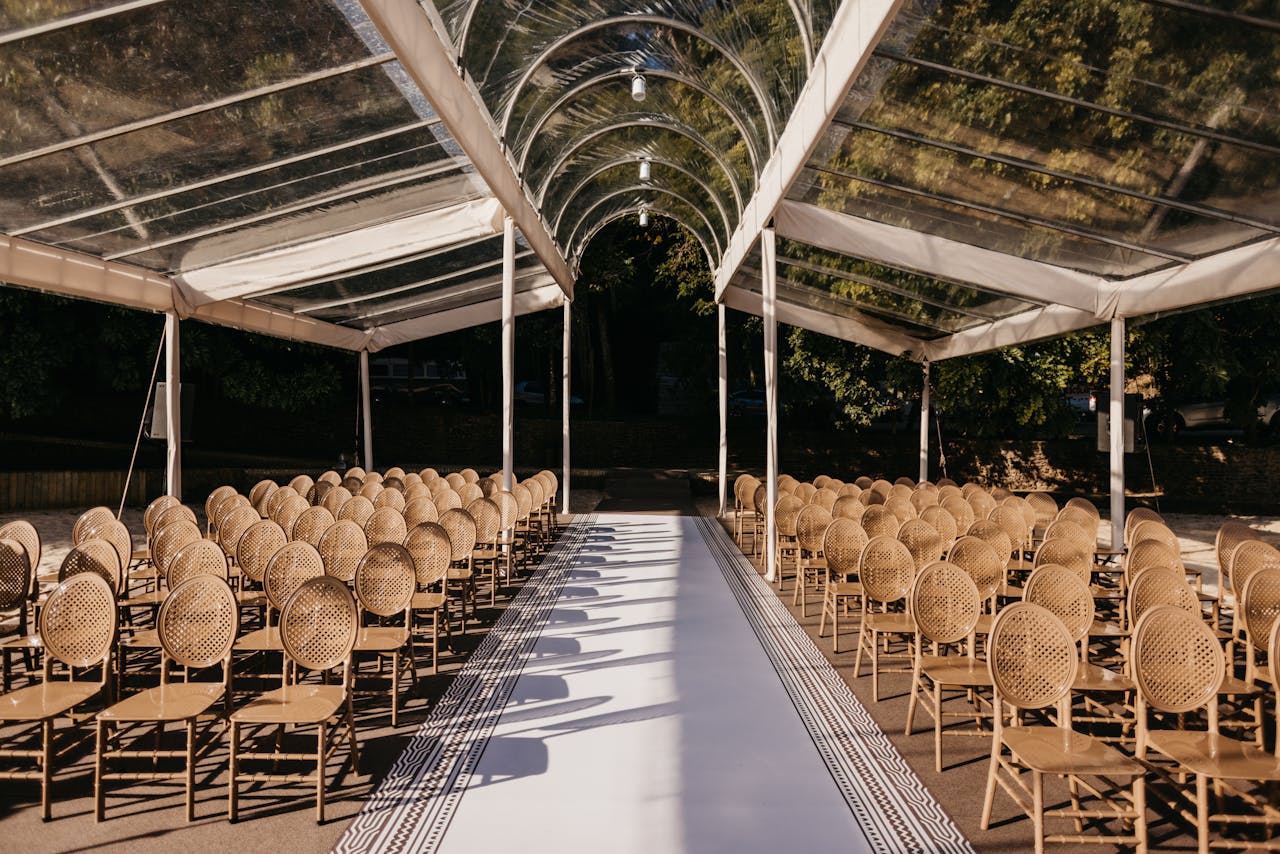 services-03 Beautiful outdoor wedding venue with stylish seating under a transparent canopy